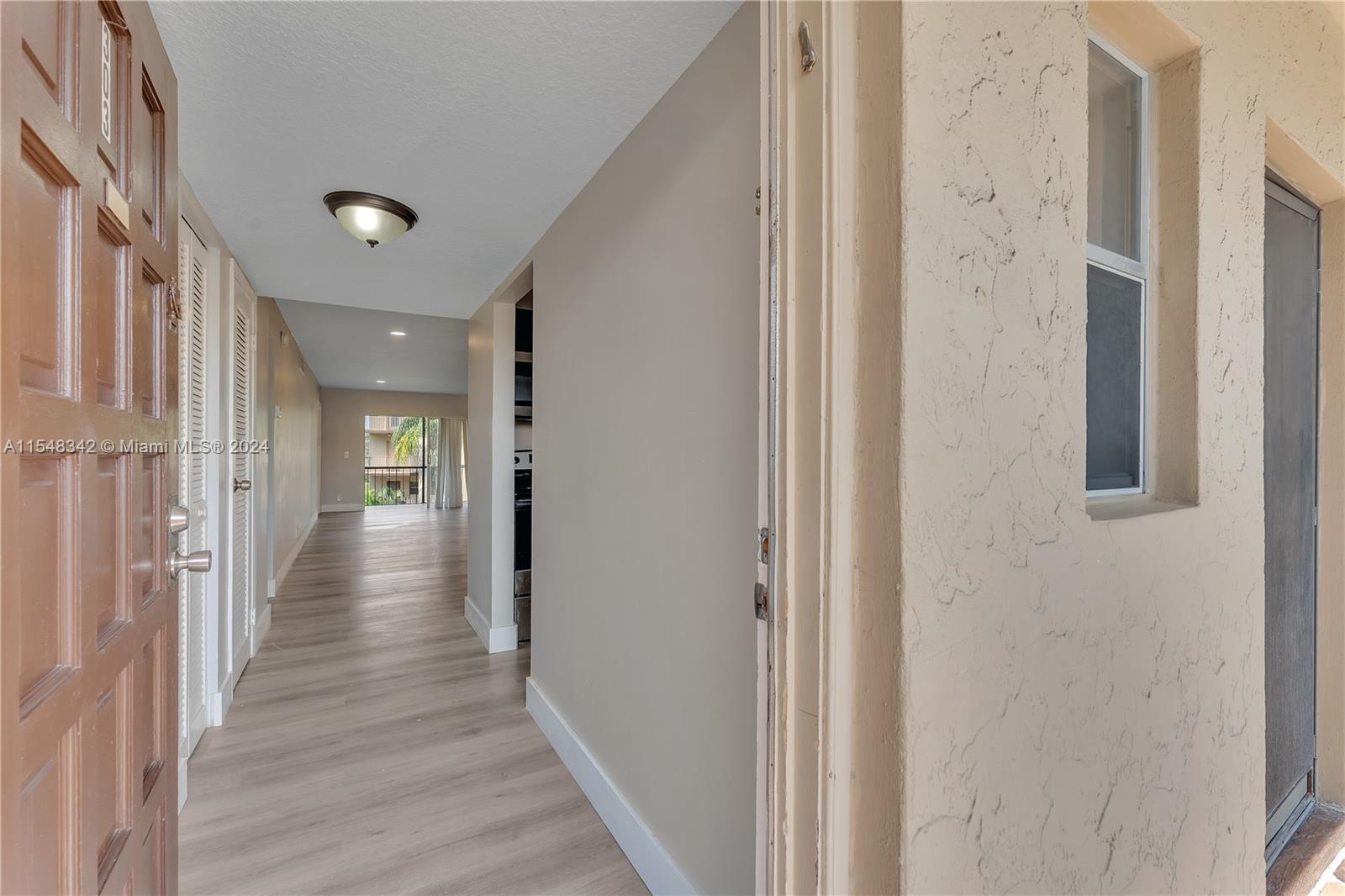 Front Door Entry w/View of Hallway Leading Out to the Patio and Outside in the Rear.