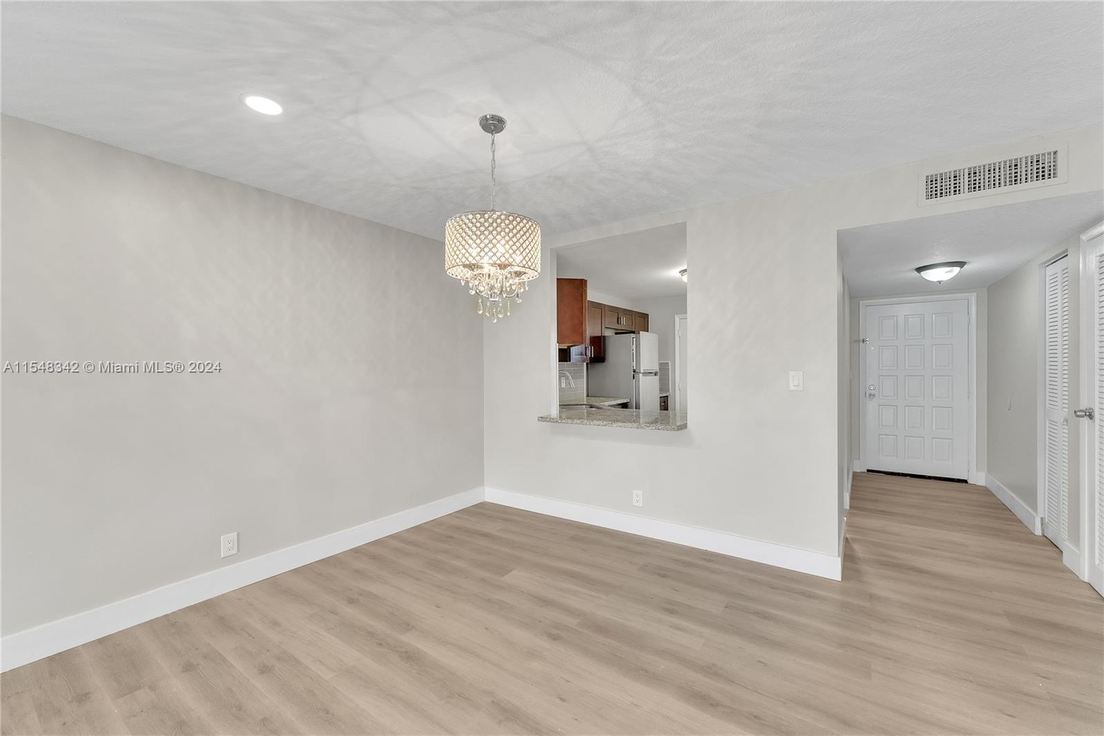 Dining Room and Hallway Leading to the Front​​‌​​​​‌​​‌‌​‌‌​​​‌‌​‌​‌​‌​​​‌​​ Door