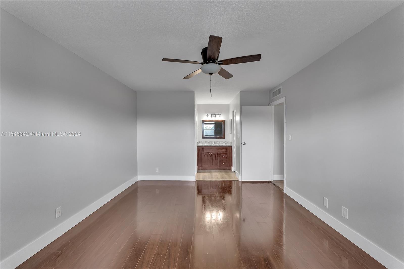 Master Bedroom w/Glimpse into Bathroom