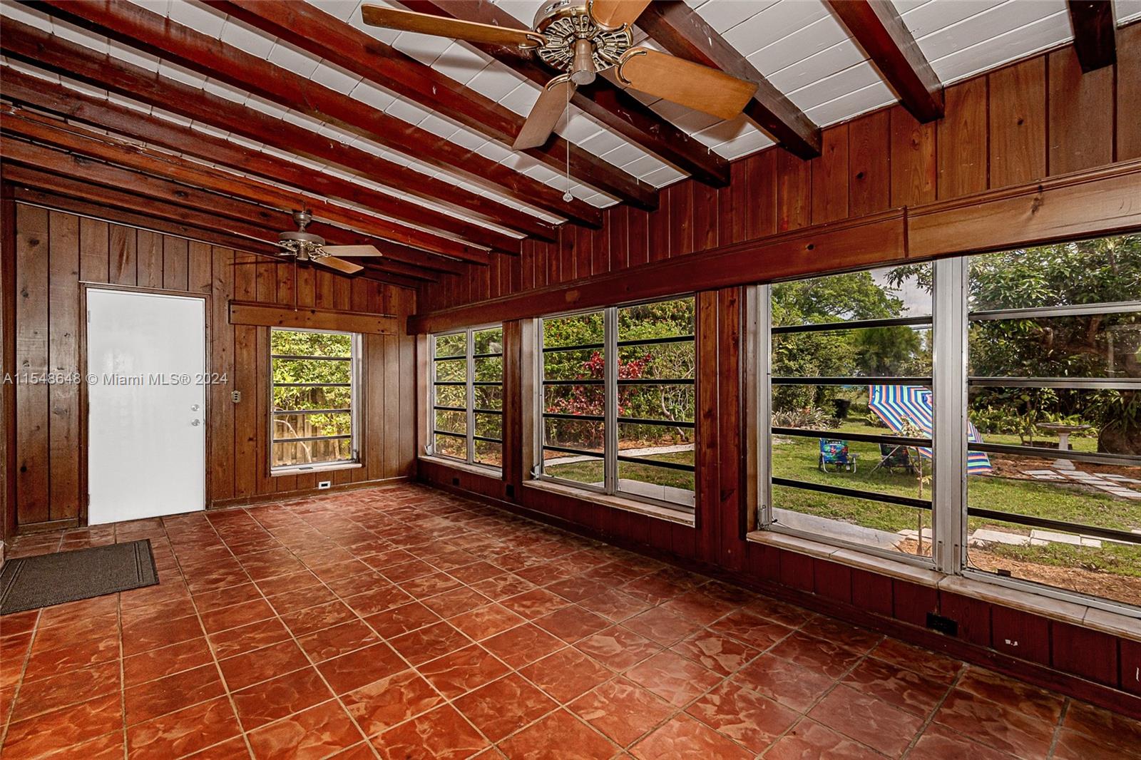 Another Florida Room view with the door to the backyard.