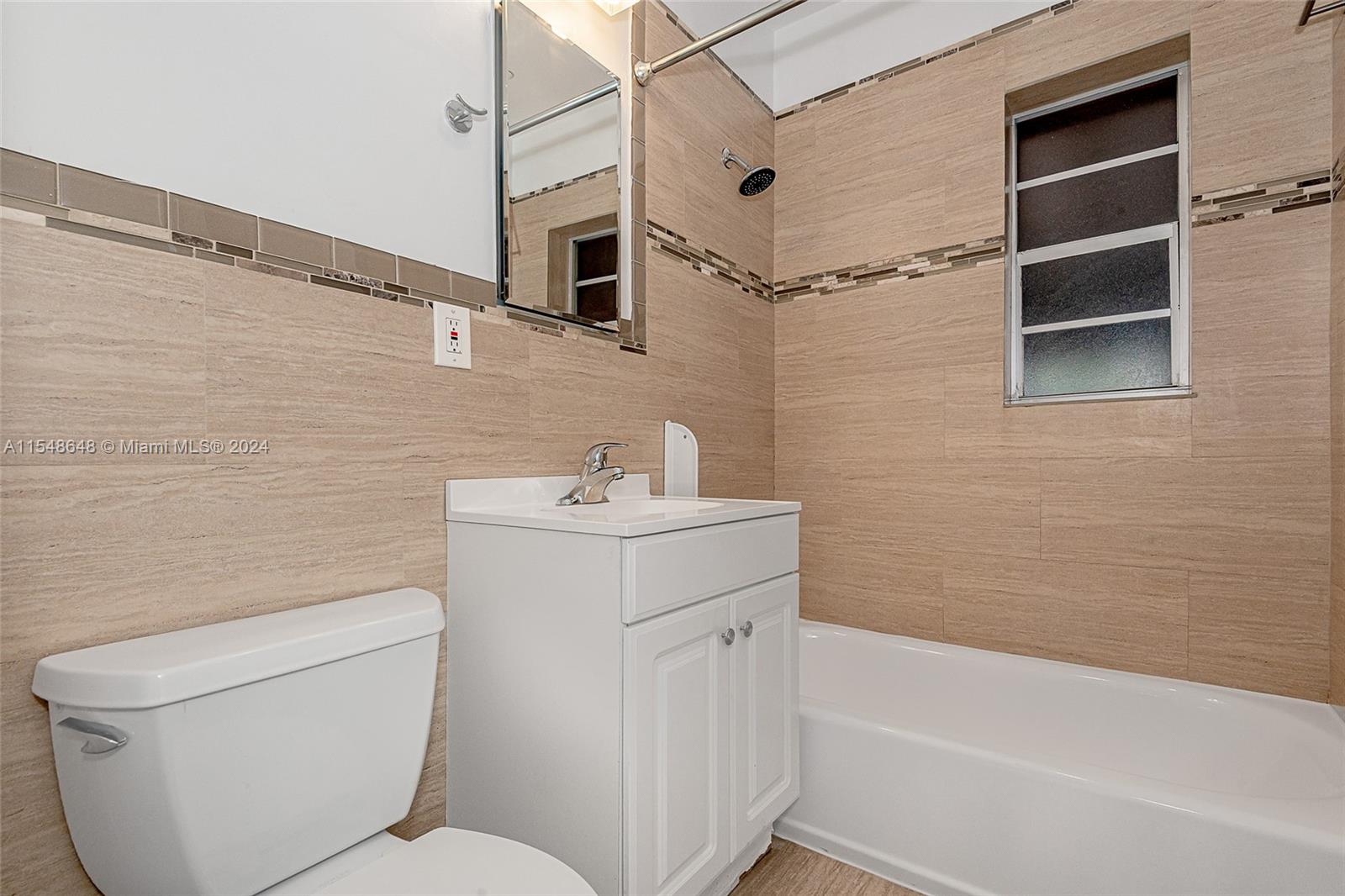 Very nice updated tile and refinished tub.