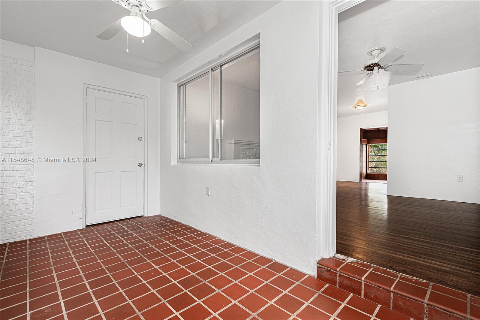 Enclosed front porch entrance.