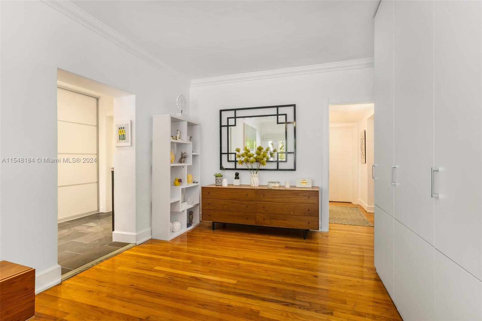 En-suite Master bedroom with built in closets with pool view.