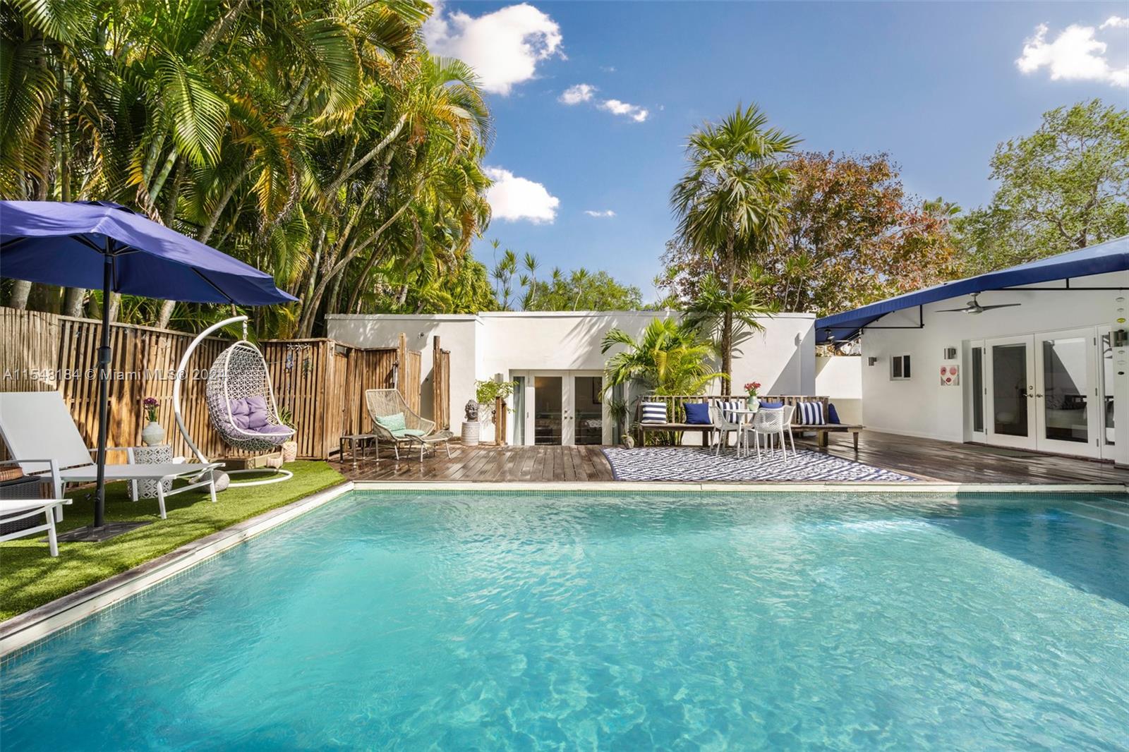 Pool view of the guest house and main house on the right.