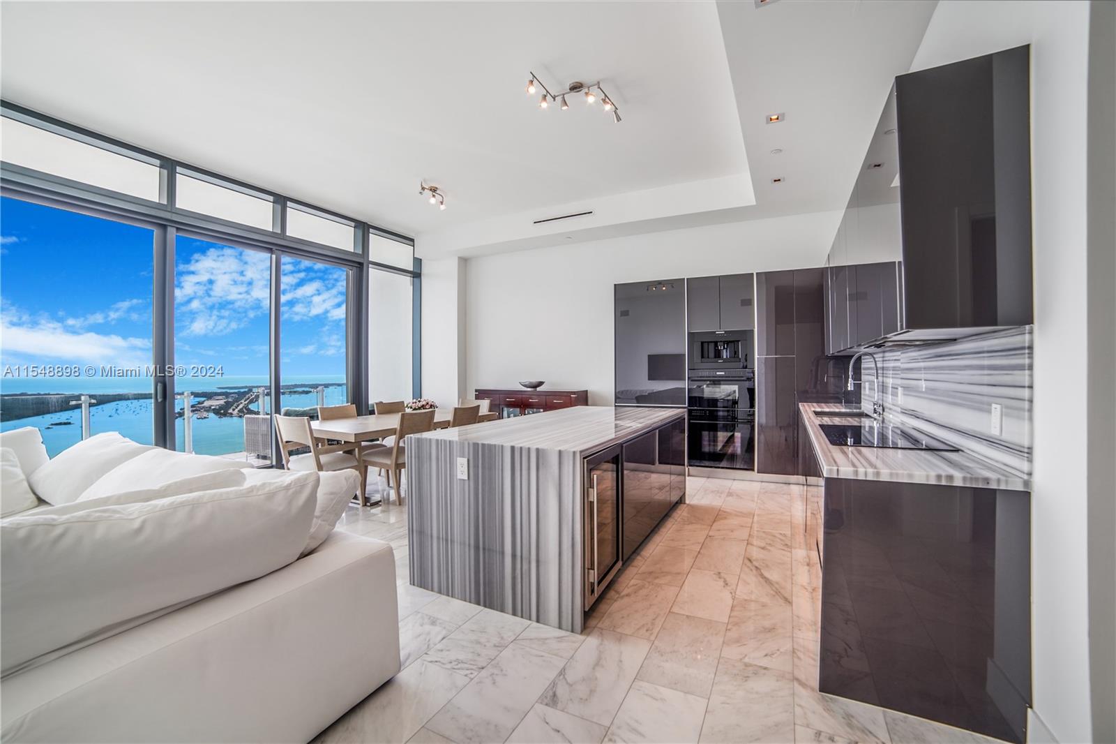 Experience mesmerizing views of Biscayne Bay and the city skyline from this lower PH corner unit in Echo Brickell featuring 3 bedrooms + den/3.5 baths, complemented by oversized terraces throughout. This sunlit unit features exceptionally high ceilings, floor-to-ceiling impact doors and windows, and a spacious primary bedroom with its own private terrace. Enjoy top of the line Wolf & Subzero appliances, espresso machine, and outdoor kitchen equipped with an electric BBQ and ice maker. Echo stands out as one of Brickell's most prestigious and intimate buildings, home to just 172 residences all benefiting from an array of world class amenities such as an infinity pool deck area offering f&b service, a gym, 24/7 concierge and security team, and close proximity to the vibrant city core.