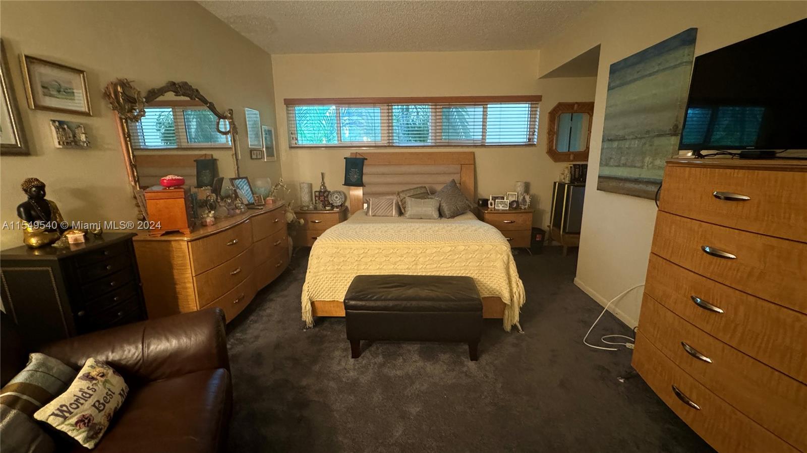 large master bedroom features bathroom -- and a walk in closet-- furniture is also for sale
