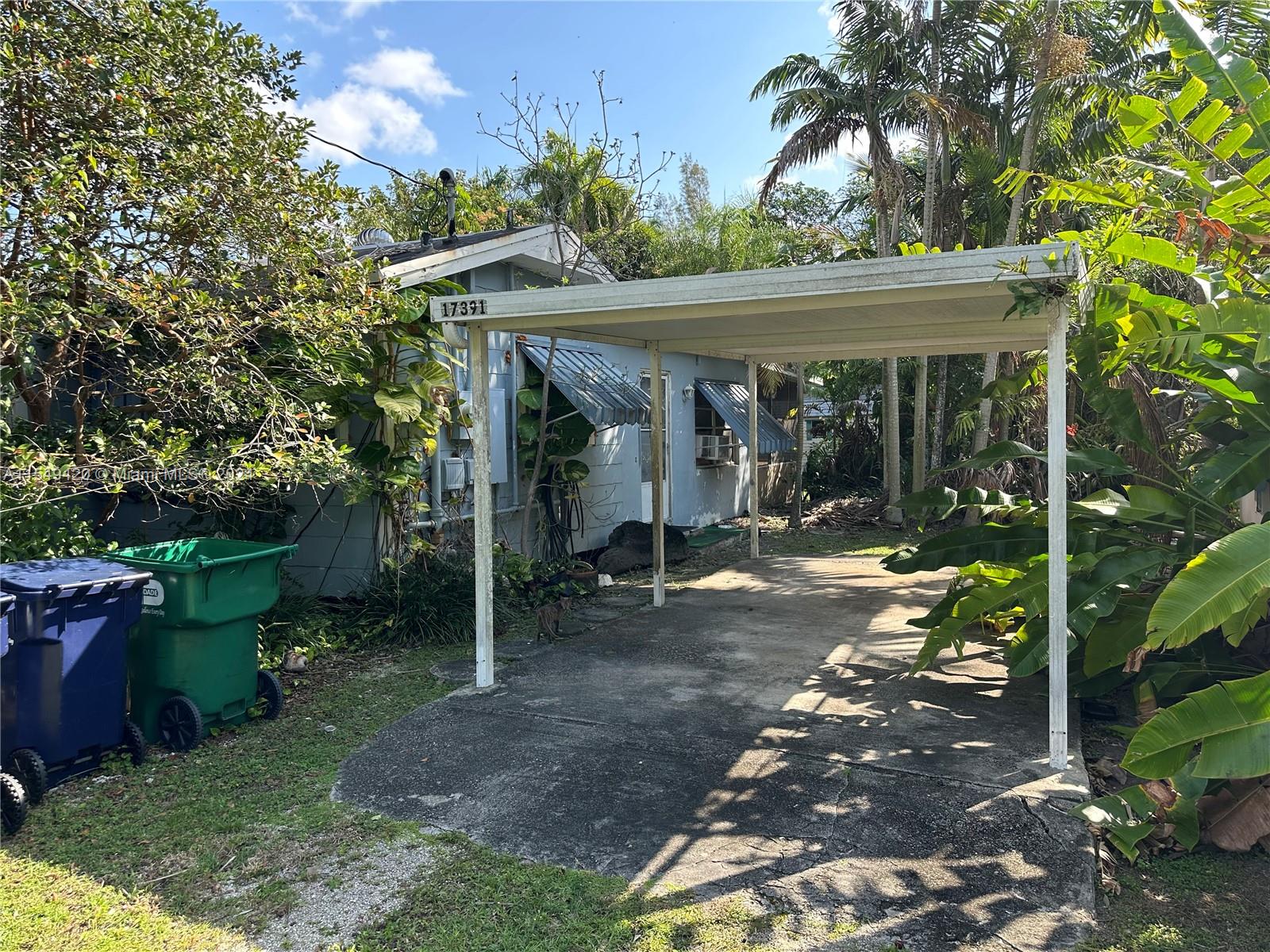 Existing carport between both small homes.