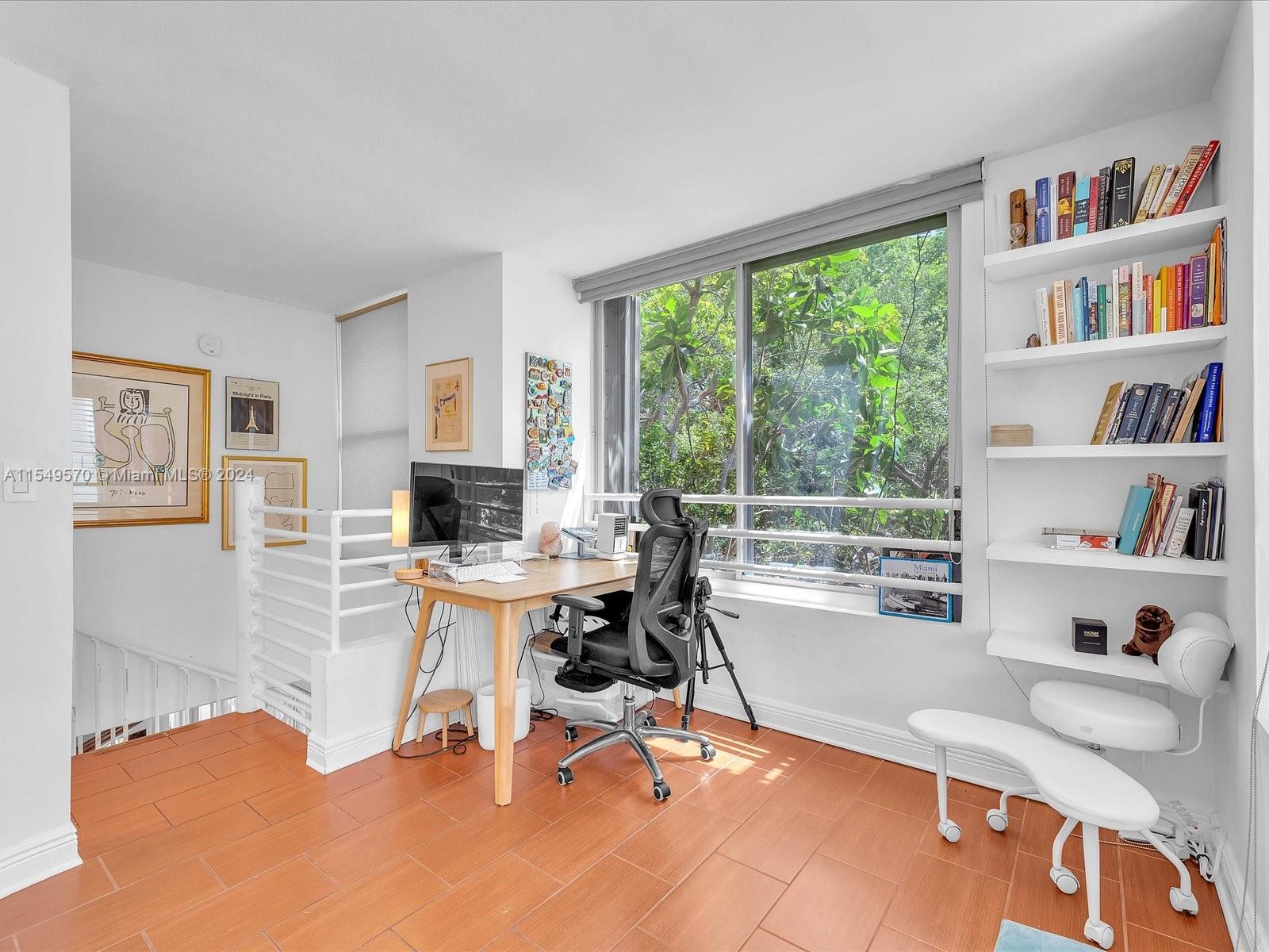 Office/Den/Bedroom sitting area with a serene view of the lush landscape