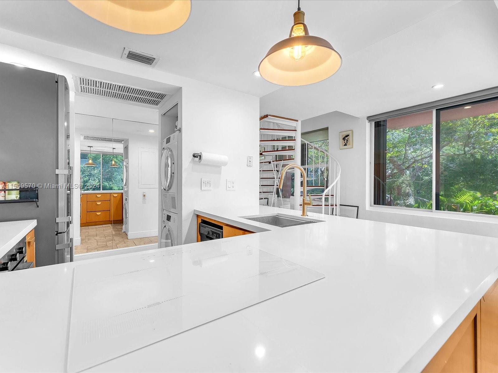 Updated kitchen with quartz countertop and induction cooktop