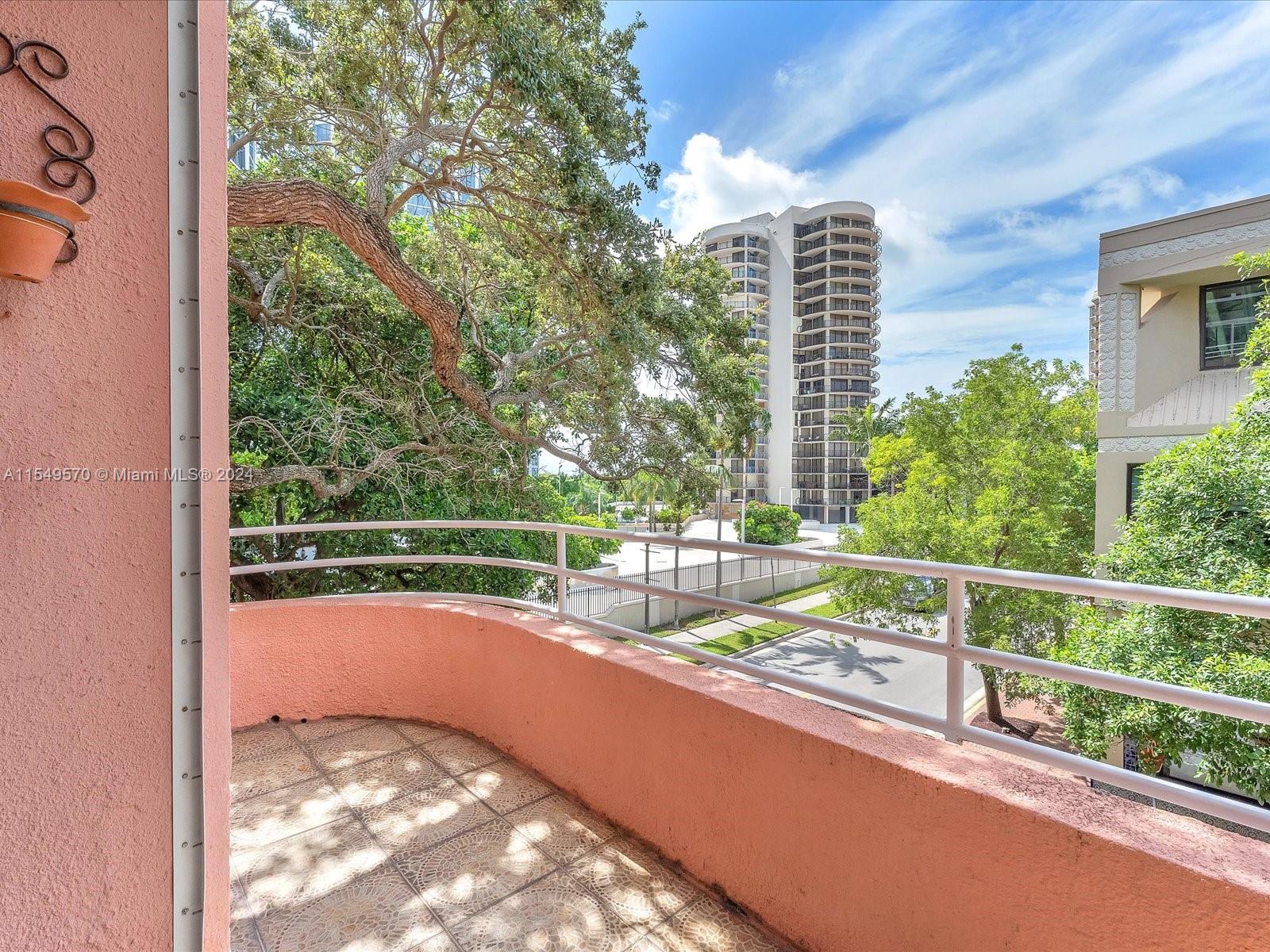 Wrap-around balcony offering a distant peek of the bay from both the balcony and the second floor