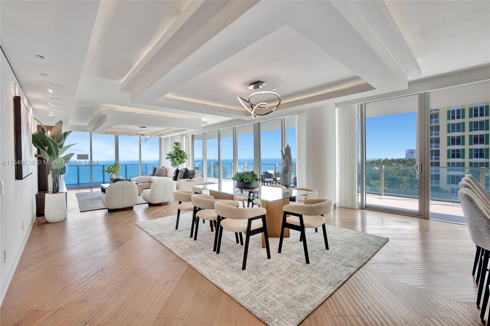 Island living redefined in this all-glass corner condo, crafted by Santiago Bernal. A Carrara Marble entrance welcomes you to luxury, with custom-designed doors and wood trims from Peru. The heart of this home features a unique barn door of iron, wood, and Texas cowboy leather belts, blending rustic charm with modern elegance. Discover steel door handles adorned with Guajira Indian beads, and European oak floors in a Chevron pattern. Enjoy sophisticated living with a Crestron system, a main bath with Kohler Steam Generator and towel warmer for relaxation. The open kitchen, highlighted by Petrified Wood, rounds out this luxurious residence. Experience incredible views and an unparalleled island lifestyle masterpiece. Incredible views and an unparalleled island lifestyle.