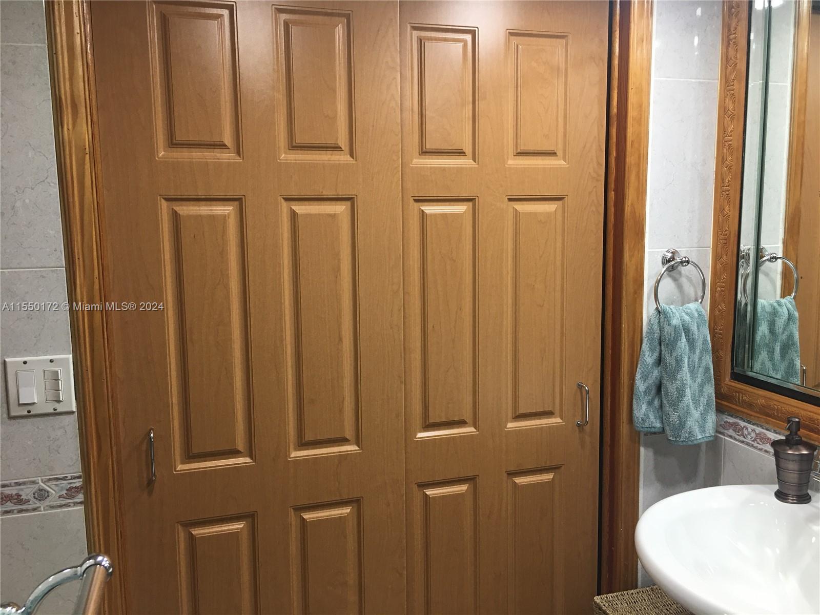 Extra Large Wall to Wall Linen Closet inside bathroom