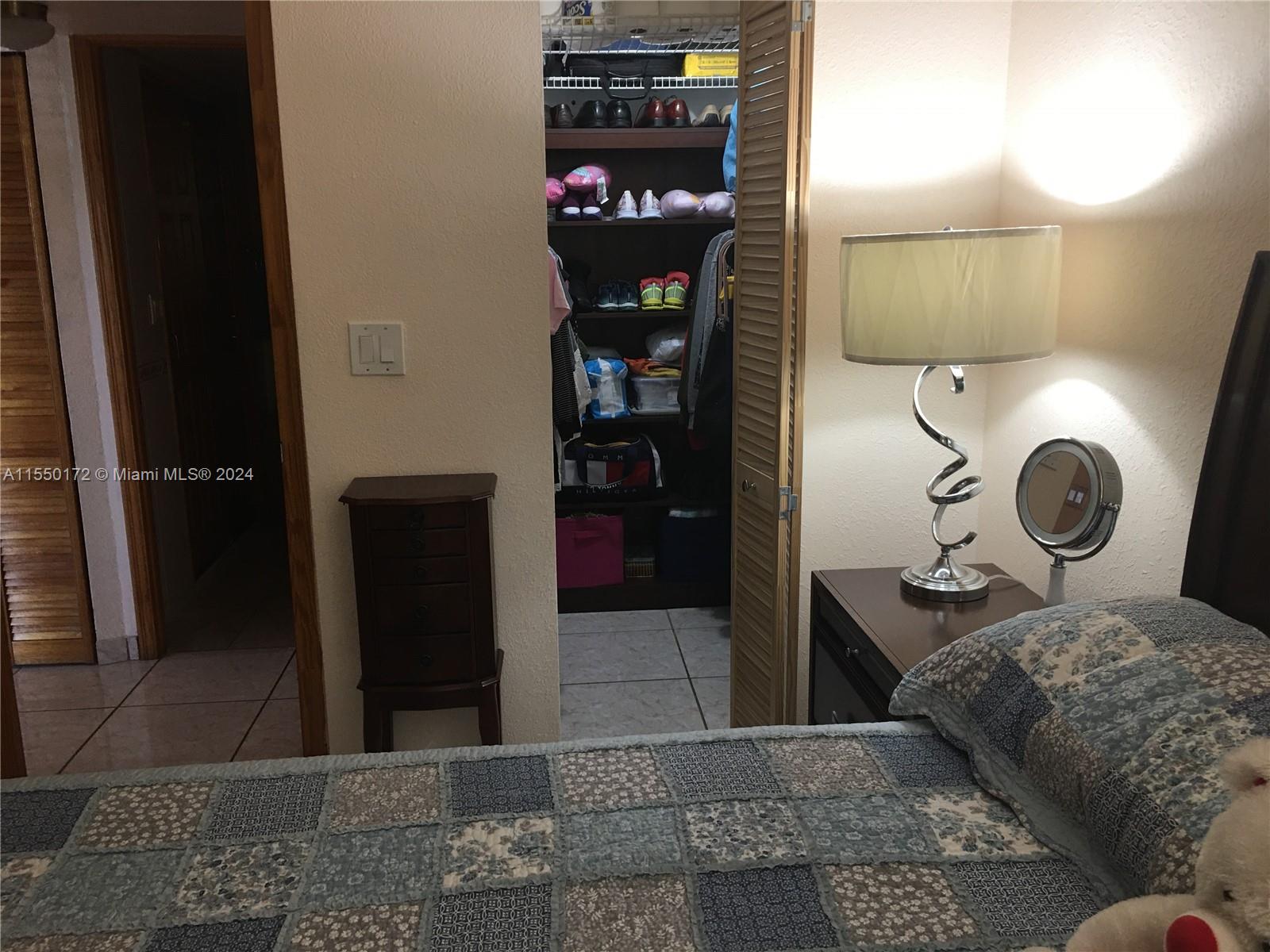 Enclosed patio with windows thru-out, wood vertical blinds