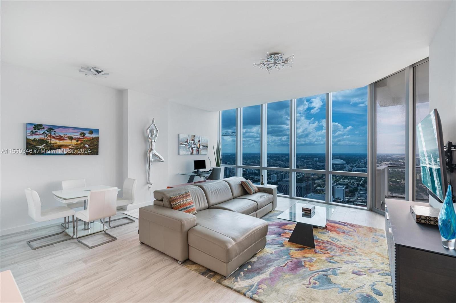 Welcome to the absolute largest 2bed/2bath condo 1,366 sq ft with stunning water, city & skyline views in all of Paramount Miami. This one of a kind unit has the a huge wide living room in the entire  as well as rare extra high vaulted ceilings. Additional features include: smart house technology system, wood porcelain tile flooring, electronic blinds in both living & bedroom, custom closets, private laundry room area, extra wide terrace, high end chef kitchen including Sub Zero and Bosch appliances, marble backsplash, Italcraft cabinets, huge master bathroom with double vanity sinks, separate soaking tub and stand up shower and much more. Have access to world class amenities including and restaurants steps away.