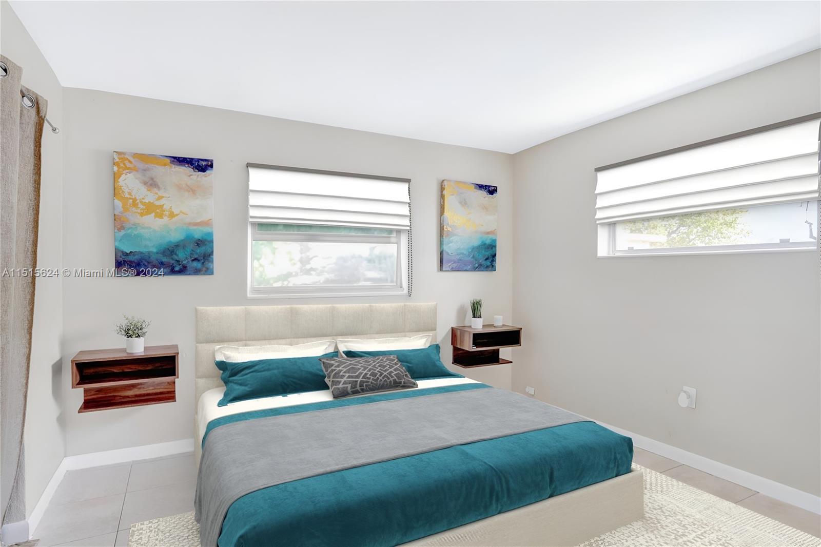 Primary bedroom is spacious enough to fit side tables and a king size bed. Photo, virtually staged.