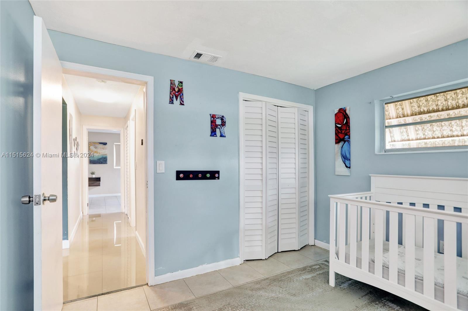 Guest bedroom is down the hall from the primary bedroom, perfect for kids.