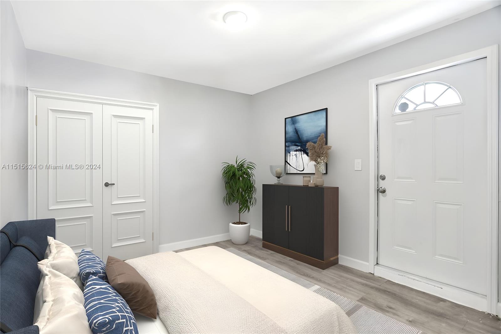 Additional bedroom resulting from garage conversion. Photo, virtually staged.