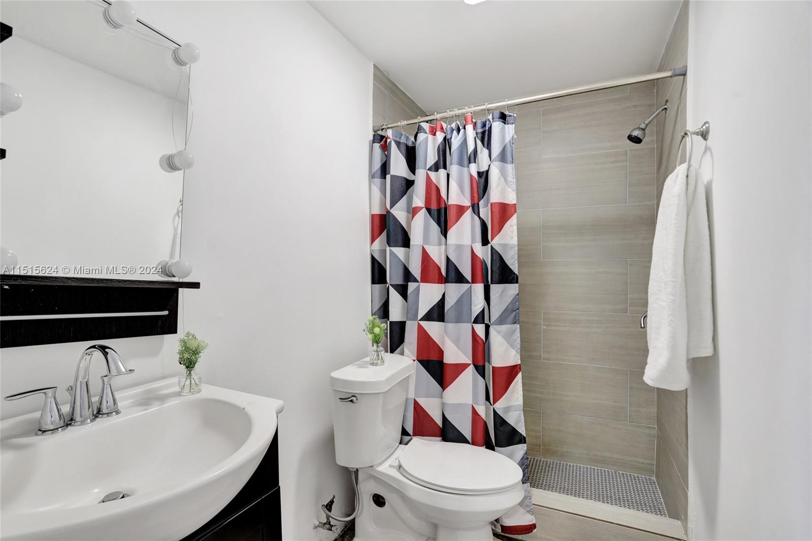 Additional bathroom resulting from garage conversion.