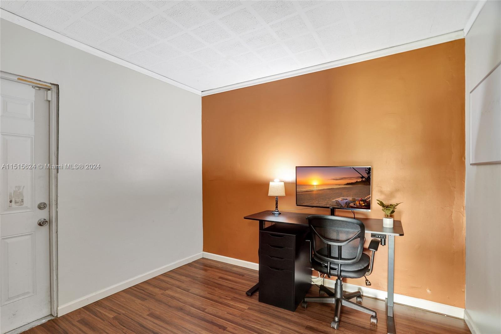 Enclosed Florida room serves as an office.