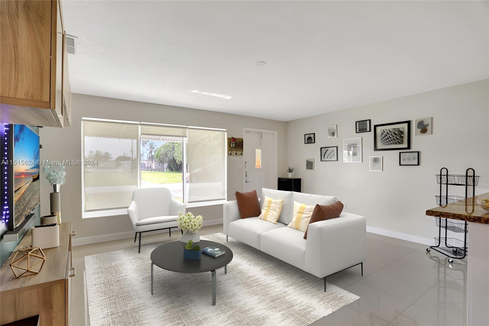 Beautiful porcelain tiles grace the spacious main living area/family room. Photo, virtually staged.