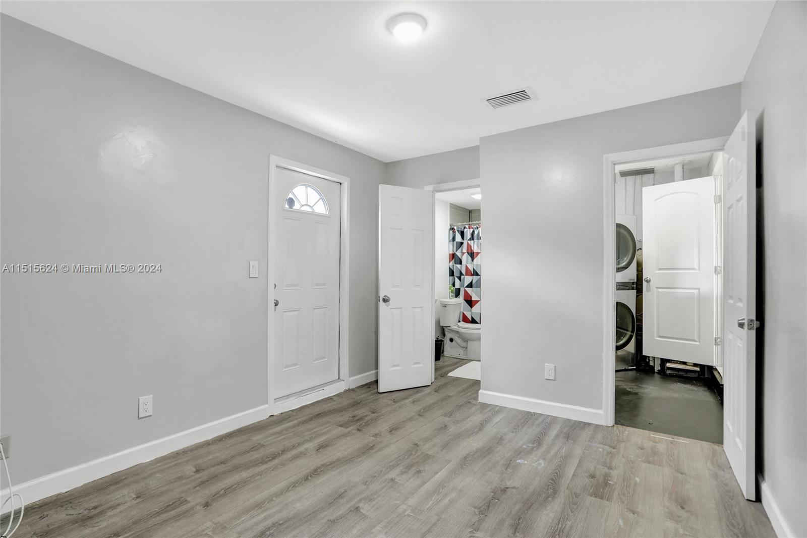 Additional bedroom resulting from garage conversion has separate entry as well as entry from the interior.