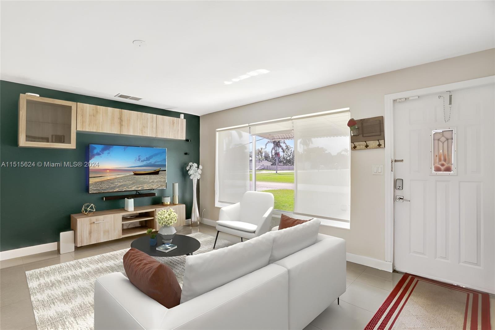Relax comfortably in the lovely family room. Photo, virtually staged.