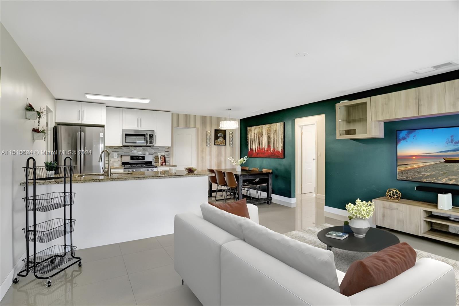 Picture yourself in this stylish, sun-drenched space where the dining and living areas are seamlessly blended. The open concept layout means you can cook & entertain your guests with ease. Photo, virtually staged.