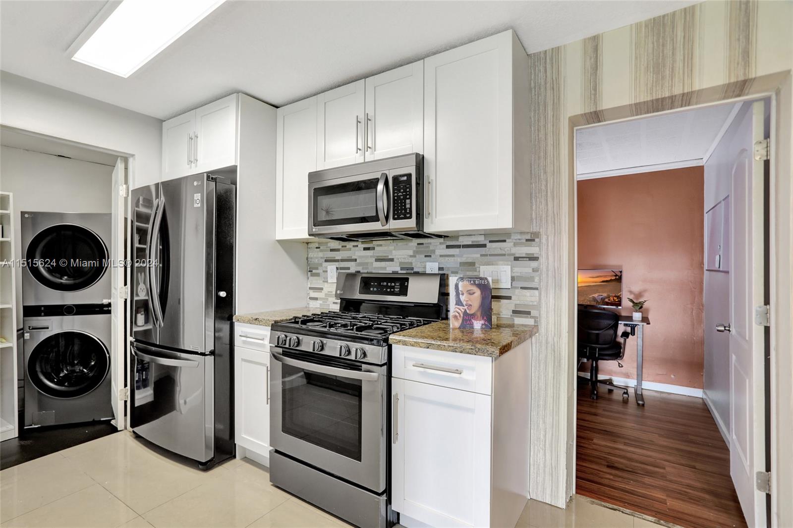 Step down from the kitchen to the laundry room with its brand new washer & dryer