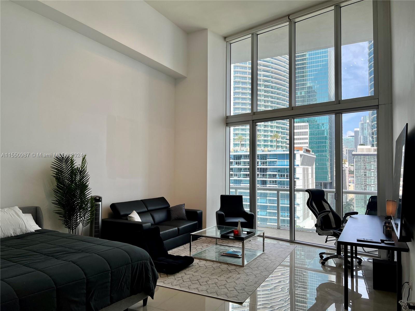 Enjoy waterfront living from this stunning double height ceiling studio residence in the heart of Miami. Features an abundance of natural light and picturesque city & river views from your private balcony. This unit offers top of the line Bosch and Wolf appliances, spacious bathroom with tub. 1 assigned parking space. Walkability 10+, short distance to the best restaurants, bars, cafes, Brickell City Center and much more. Icon Brickell designed by Philippe Stracks offers 5-star amenities, resort style pool, fitness center, spa, multiple top restaurants onsite & much more. Fully Furnished.