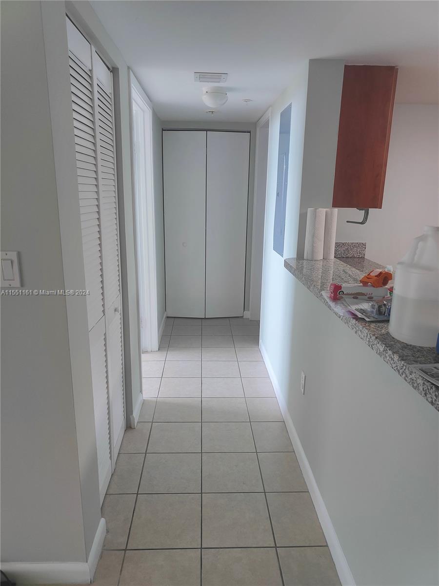 Hallway to bedroom and second bathroom