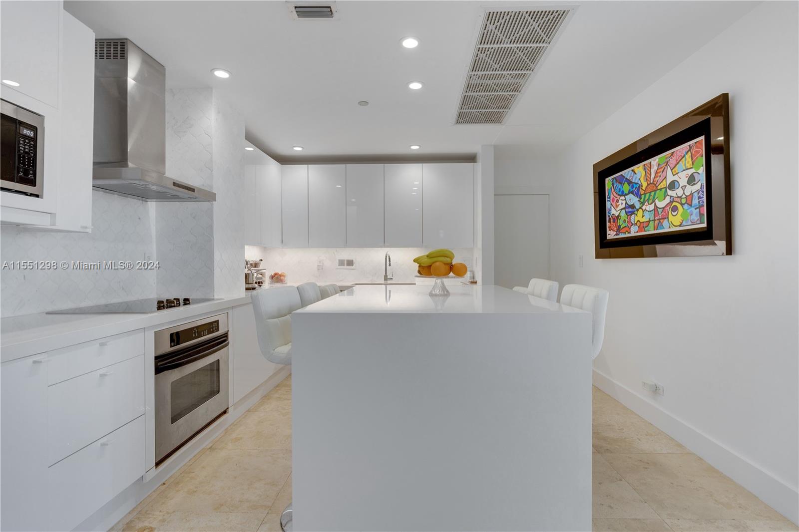 Step into this stunning living room and be greeted by a breathtaking view of the iconic Miami skyline. The floor-to-ceiling windows, complemented by the 10 ft ceilings, flood the apartment with an abundance of natural light, creating a spacious and airy atmosphere. The modern design and open layout make this the perfect space for both relaxation and entertaining, with the vibrant cityscape serving as the ultimate backdrop.