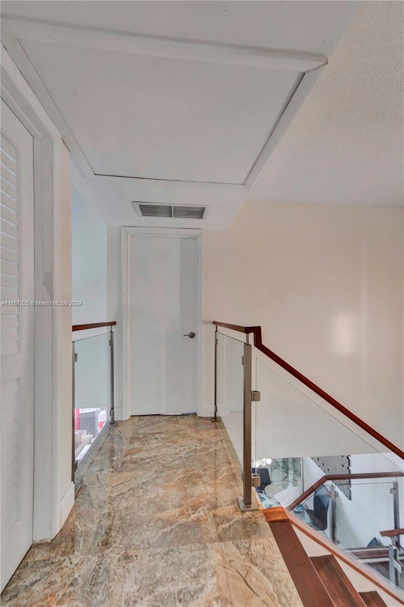 Master bedroom with balcony and walk in closet
