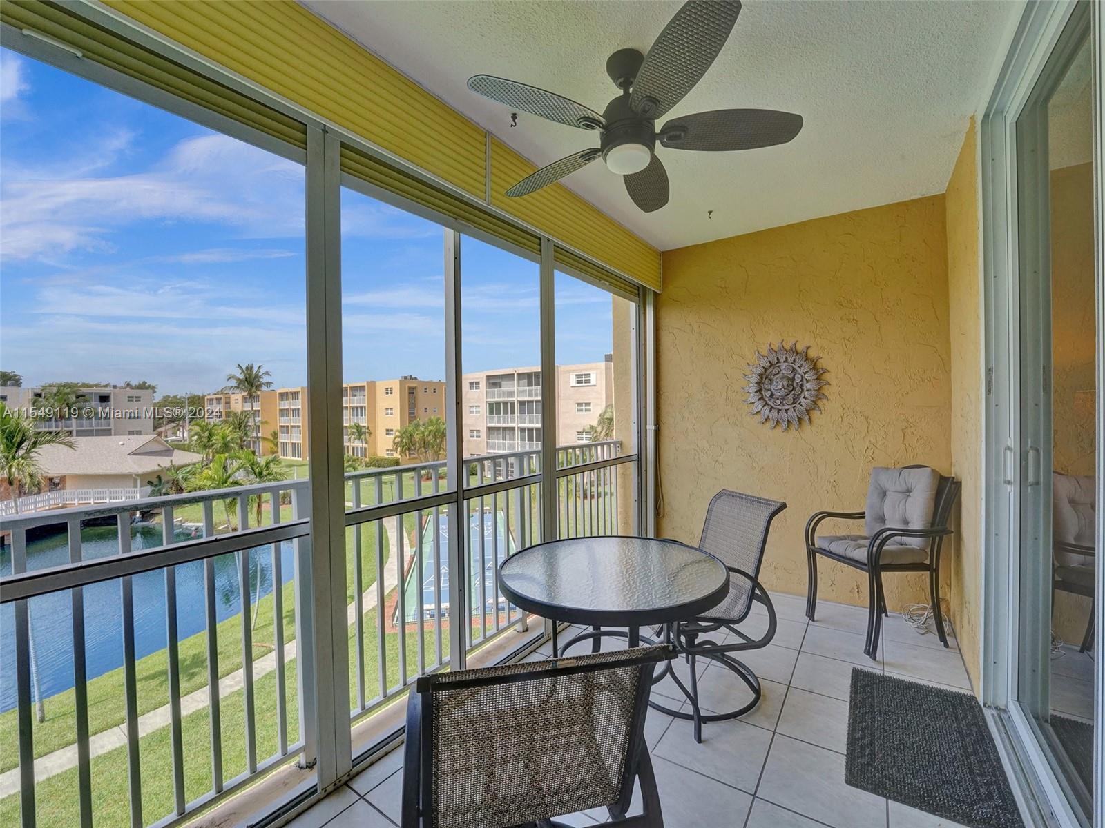 Screened & covered balcony with lake views!