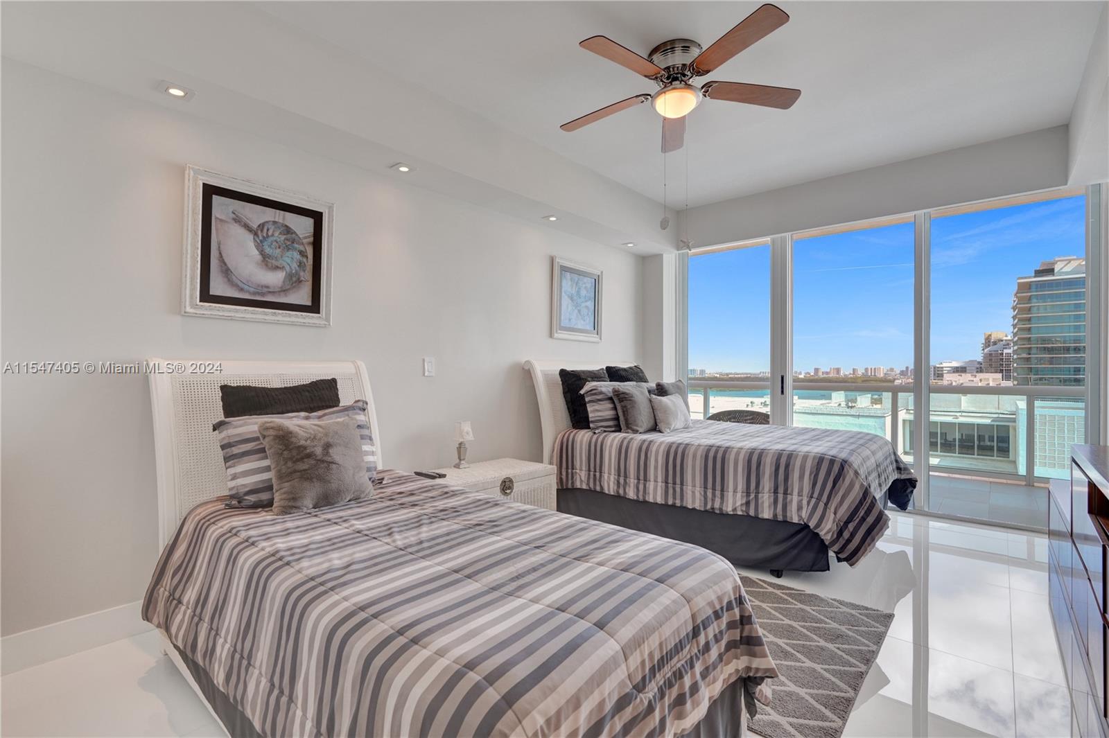Suite 1 with walk-in closet, balcony access and personal items storage.