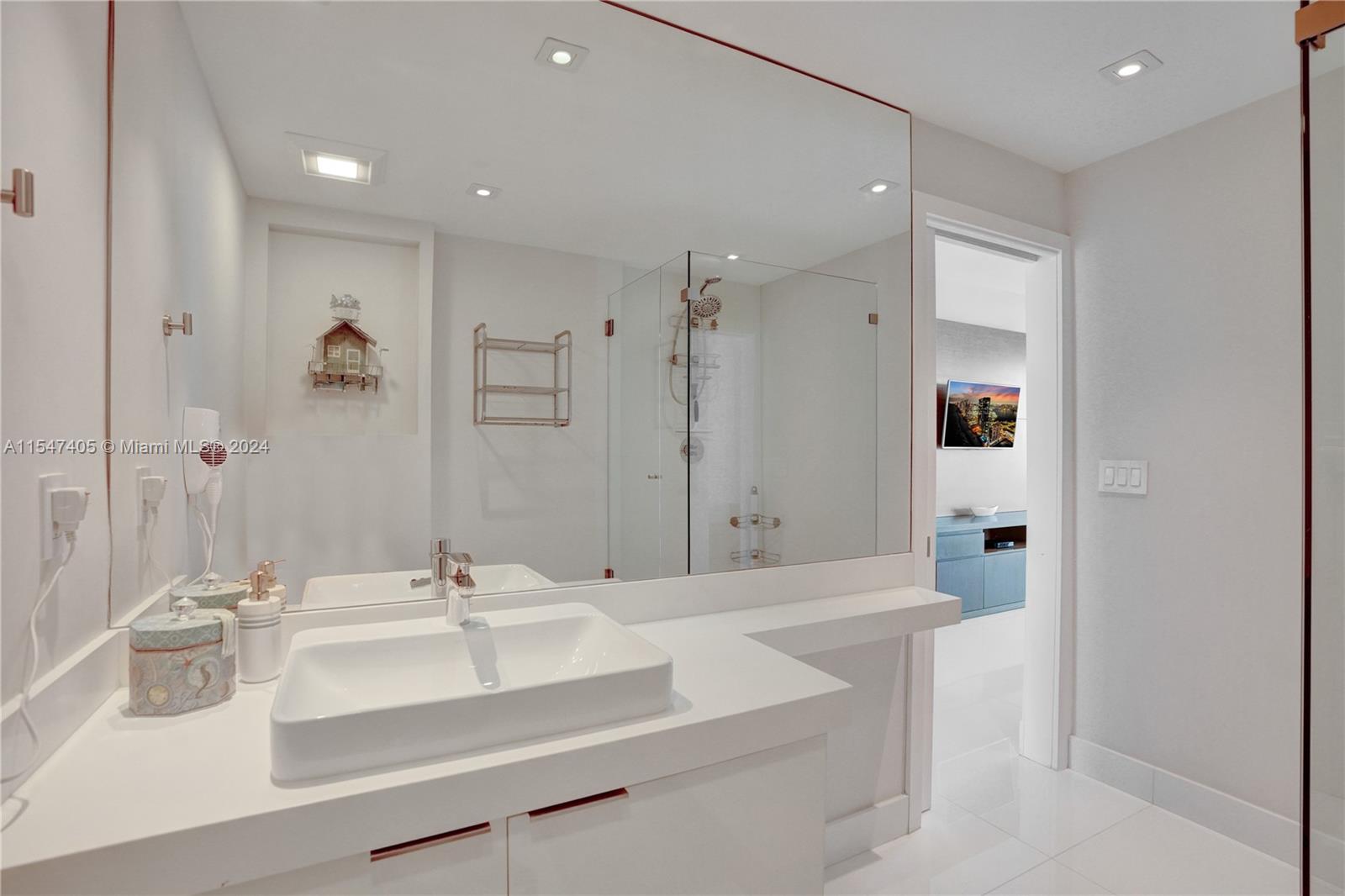 Full laundry room, with retractable staff bed and full bath. Lots of storage & cabinets.