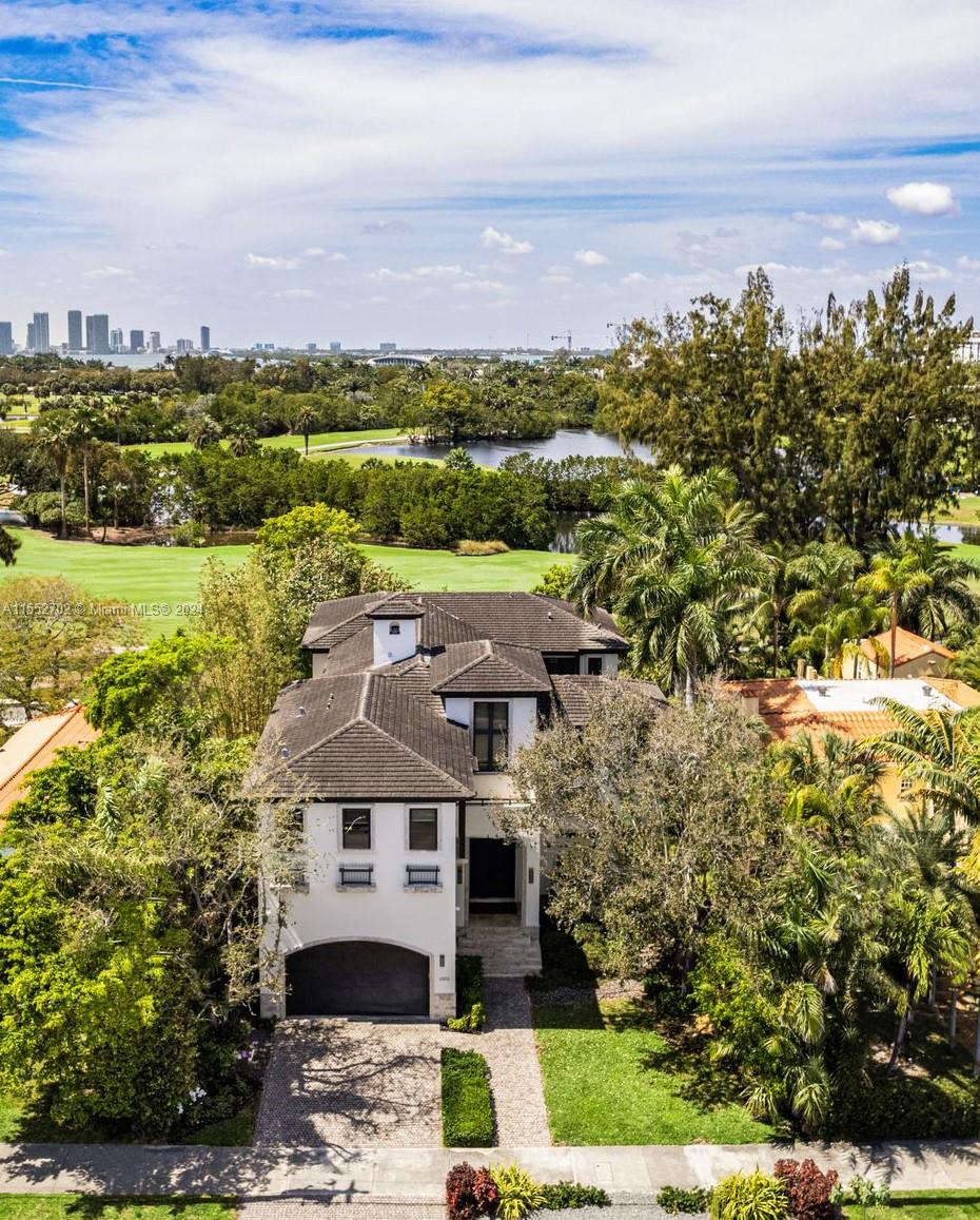 Situated directly on the serene Miami Beach golf course, this two-story family home boasts casual elegance & optimal lifestyle. This upscale 6 bed, 7 full bath home is 5,725 SQFTft on an oversized 9,750SQFT lot. High ceilings, light filled living spaces & custom designer finishes throughout. Entertain in the open kitchen & great room or out on your spacious covered patio overlooking the sparkling heated pool & beautifully manicured golf greens. Expansive principal suite w/boutique style walk-in closet, newly renovated spa-like bathroom & private balcony. Enjoy gracious guest bedrooms situated around an upstairs living/homework area. Add’l features: Chef’s kitchen w/ top of the line appliances, 2 car garage, large laundry & staff quarters. Moments away from top restaurants, shops & beaches!