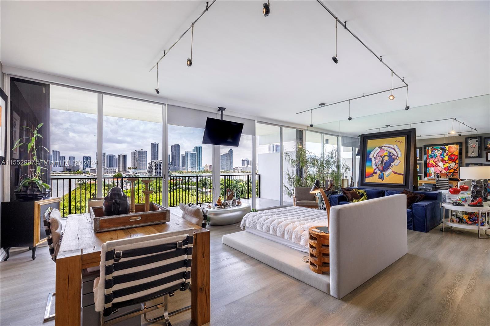 Nestled on 5 acres of prime waterfront land- this tastefully renovated townhouse opens to breathtaking pano-views of Biscayne Bay, Miami Sunsets and Skyline. Floor to ceiling windows w/ a staircase to a second floor. Designer touches: Plexi-glass stairway, Cement Wall, Industrial Lighting, and Venetian Plaster throughout. Herald for its unique design, location and views- 1000 Venetian Way is the city's most sought after addresses on the Venetian Islands. With a world class health club and spa, 24/7 Concierge, a resident's lounge, 2 tennis courts, 2 swimming pools- Location, Views, Amenities. This home has it all!! 40 Year Certification passed-Well Managed, Maintained and Reserves met!!! Turn-key and Easy to show!!! Make this home your own!!!