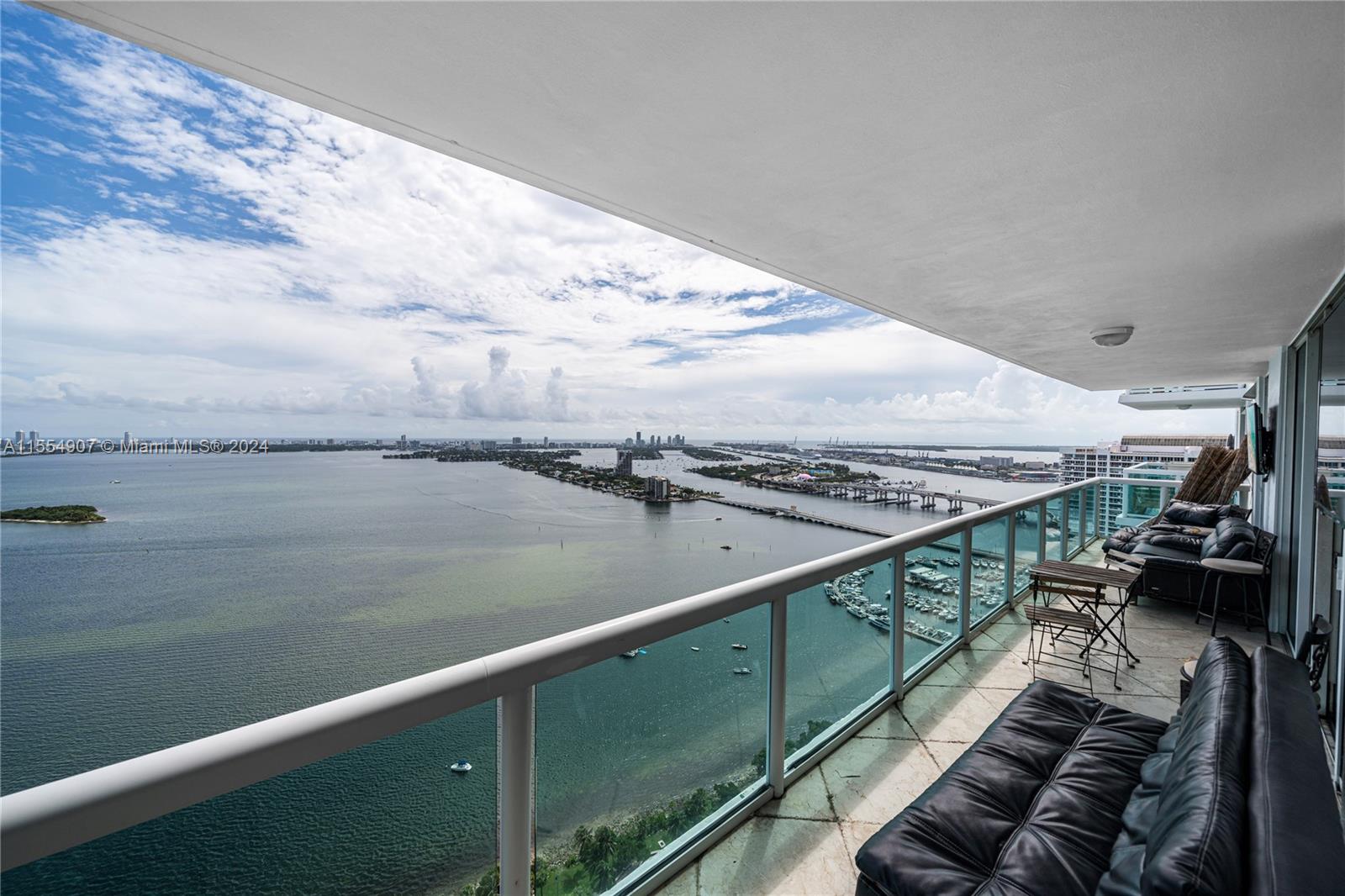 Enjoy amazing panoramic views of Biscayne Bay from this gorgeous apartment in the sky! This 2 bedroom/2 bath split plan condo has been upgraded to feature marble floors throughout the bedrooms & living areas, front loading washer/dryer, the kitchen overlooks the dining area with granite counter tops and top of the line stainless steel appliances. HUGE balcony where you can enjoy the serene views of the bay. Beautiful pet friendly park in front of the building features a dog area, work out stations, tennis, volleyball & much more. Amenities at 1800 Club include a 2-story lobby, 24-hour valet parking, on-site waterfront restaurant, heated swimming pool, Zen garden, 2-story recreational floor with deck, gym, yoga/aerobics studio, sauna, steam room, massage rooms, party room & billiards room.