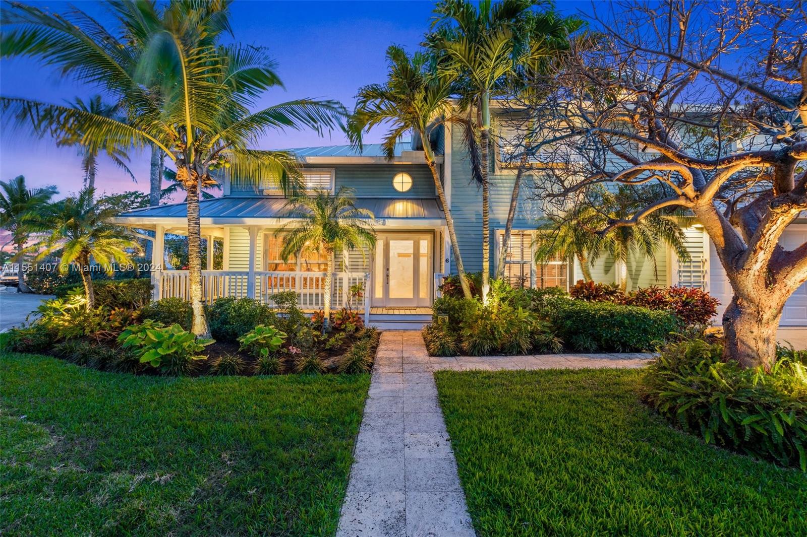 Stunning Key West style residence nestled along the tranquil waters of central Palm Beach County. Boasting 130 feet of waterfront & situated on a sprawling 1/3-acre lot, this home offers an unparalleled opportunity to embrace the ultimate coastal lifestyle. Soaring ceilings welcome you into a spacious floor plan & open kitchen offering subzero refrigerator & freezer, gas cooktop with downdraft ventilation, pot filler, large island with prep sink & built-in wine fridge. Enjoy aquatic adventures or relax in your own private oasis with large screened porch, bar, outdoor kitchen, pool & spa, waterfront fire pit, dock & boat lift. Additional features include new metal roof & 2 car garage. This prime location is on a private and quiet street right across the intracoastal from Ocean Ridge.