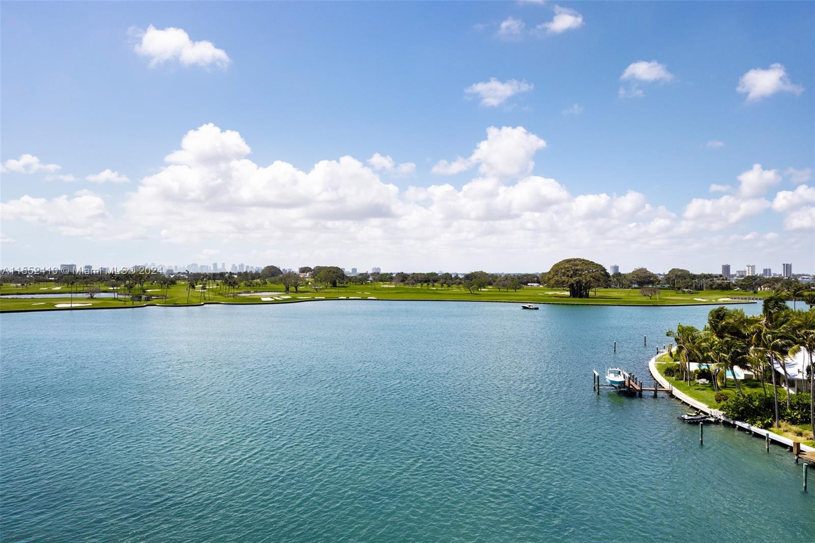 Oversized PH corner unit in boutique Bay Harbor bldg w/ sweeping views of the bay, Indian Creek Golf Course & downtown Miami skyline. Flow thru w/ huge prim suite w/ H/H baths & 2 large walk-ins, guest room w/ ensuite BR & 2 walk-ins + powder rm.  Great for entertaining w/ spacious living/dining, large bar, dine-in kitchen & laundry rm. Sit on the expansive terrace to take in the beautiful view. Includes boat slip, private garage + 2nd space. Walk to Kane Concourse, Bal Harbor shops & beach!