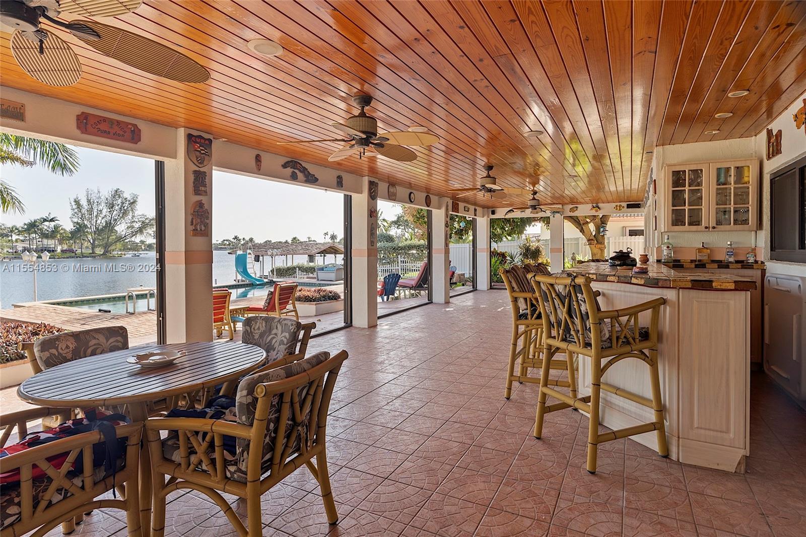 Backyard with Pool, Pavers, Gazebo with Grill, Trees, Dock, Ramp and Sun Deck