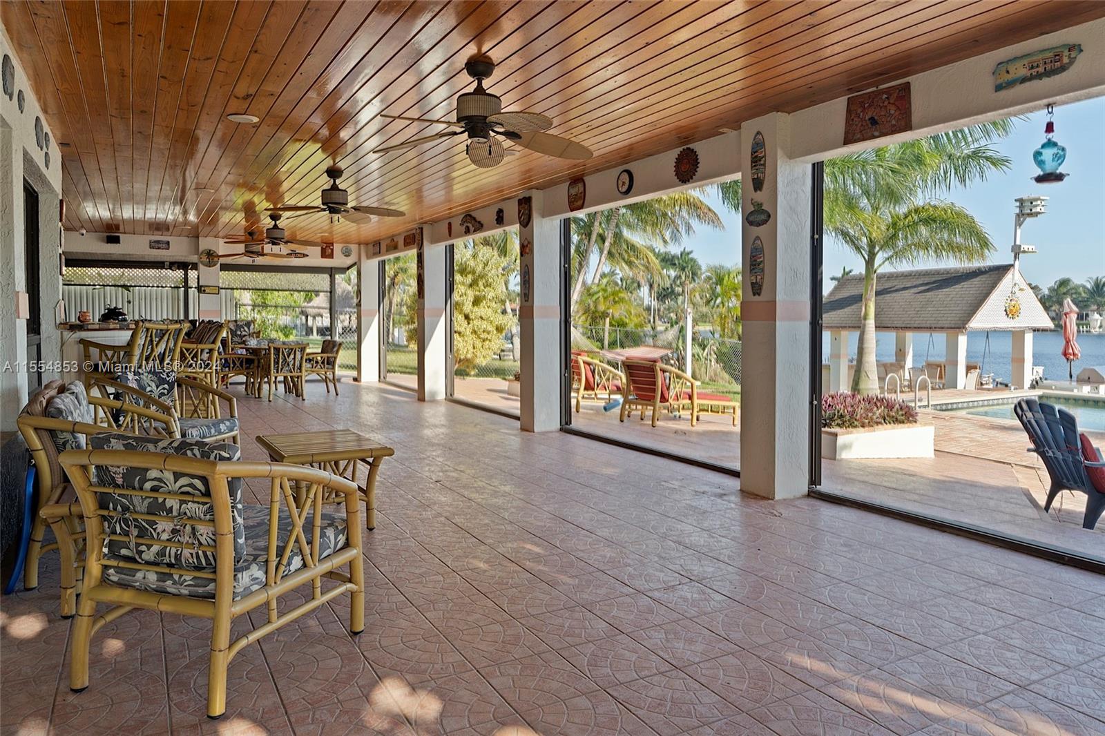 Backyard with Pool, Pavers, Gazebo with Grill, Trees, Dock, Ramp and Sun Deck