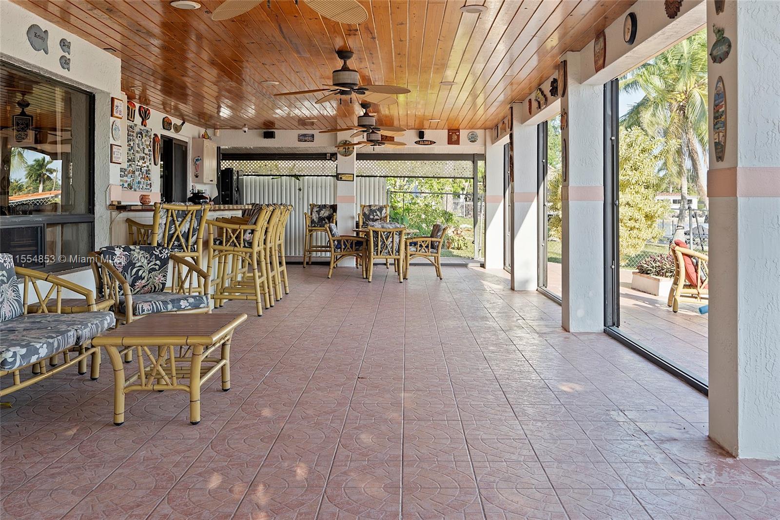 Backyard with Pool, Pavers, Gazebo with Grill, Trees, Dock, Ramp and Sun Deck