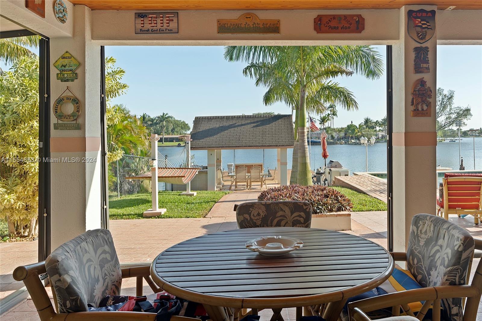 Backyard with Pool, Pavers, Gazebo with Grill, Trees, Dock, Ramp and Sun Deck