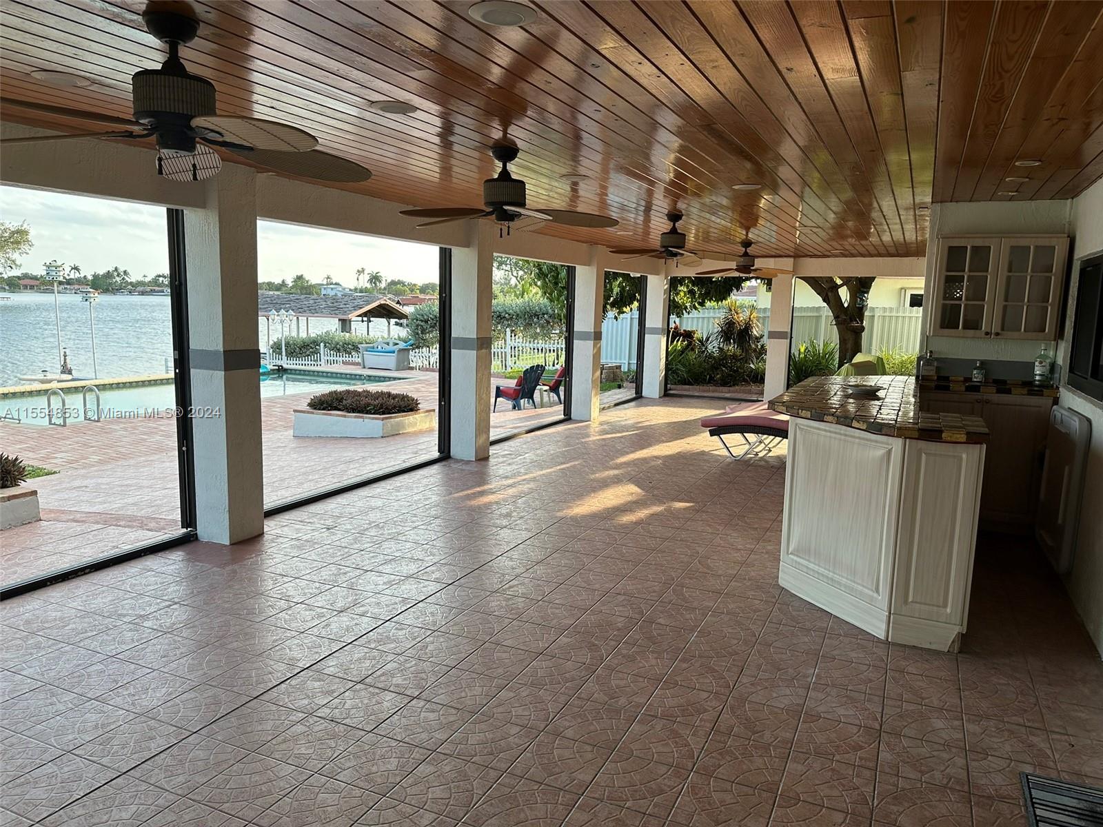 Backyard with Pool, Pavers, Gazebo with Grill, Trees, Dock, Ramp and Sun Deck