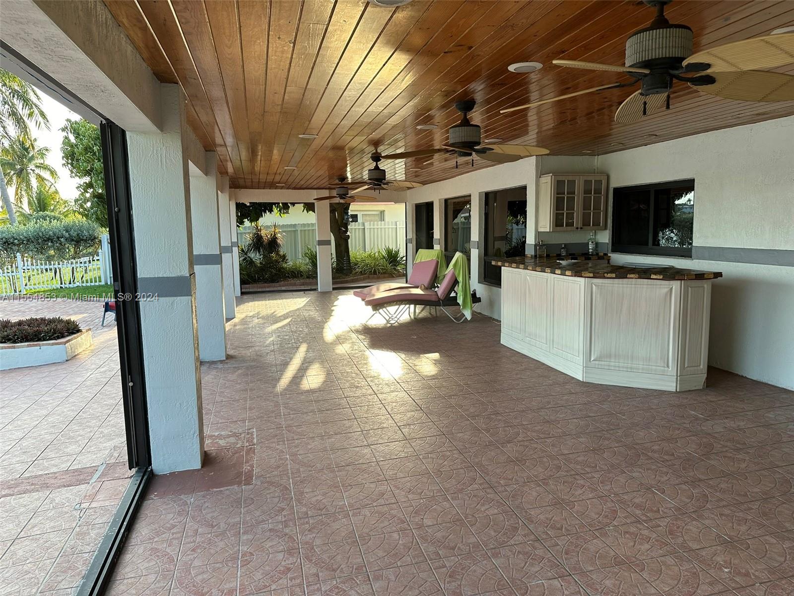 Backyard with Pool, Pavers, Gazebo with Grill, Trees, Dock, Ramp and Sun Deck