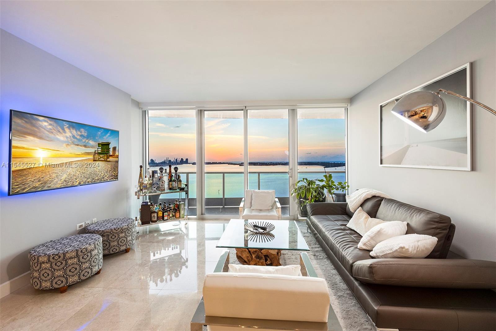 Discover the epitome of luxury living at Jade, where every room of this condo captures the breathtaking morning sunrise over Biscayne Bay, Fisher Island, and the Port of Miami. A private elevator leads to 1760sf of the finest marble flooring throughout the entire home, with a versatile den perfect for a 3rd bedroom or workspace. Enjoy one of the best managed buildings in Brickell with top-tier amenities including a premier gym, two waterfront pools with cabana service, and the exquisite Asian Mediterranean cuisine of Consentido, located on the lobby level. Host magnificent gatherings in the Penthouse Club Room, with unlimited complimentary valet parking for your guests. Jade is the pinnacle of Brickell's sophistication, offering unparalleled elegance and convenience in the heart of Miami.