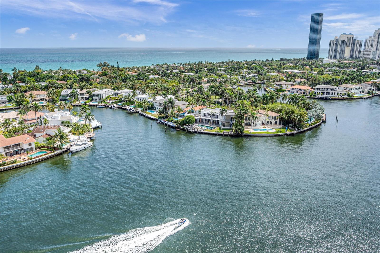 Step off your private elevator into this expansive waterfront residence offering 2 beds, a den + a home office, and 2.5 baths. Its flow-through floor plan allows you to enjoy water and city views. The East terrace faces serene sunrises over the Intracoastal and Atlantic, while the west terrace showcases captivating sunsets overlooking the Turnberry Golf Course and cityscape. Features include marble floors, electric blinds, built-in wet bar, stainless steel appliances, a spacious primary suite with walk-in closet, a bathroom with dual vanities, 2 Assigned parking spaces and storage. Amenities include 24 hr security, valet, infinity pool, theater, tennis courts, gym, clubhouse, and exclusive restaurant. Minutes from the beach and a scenic walking path, it's the epitome of leisure and luxury.