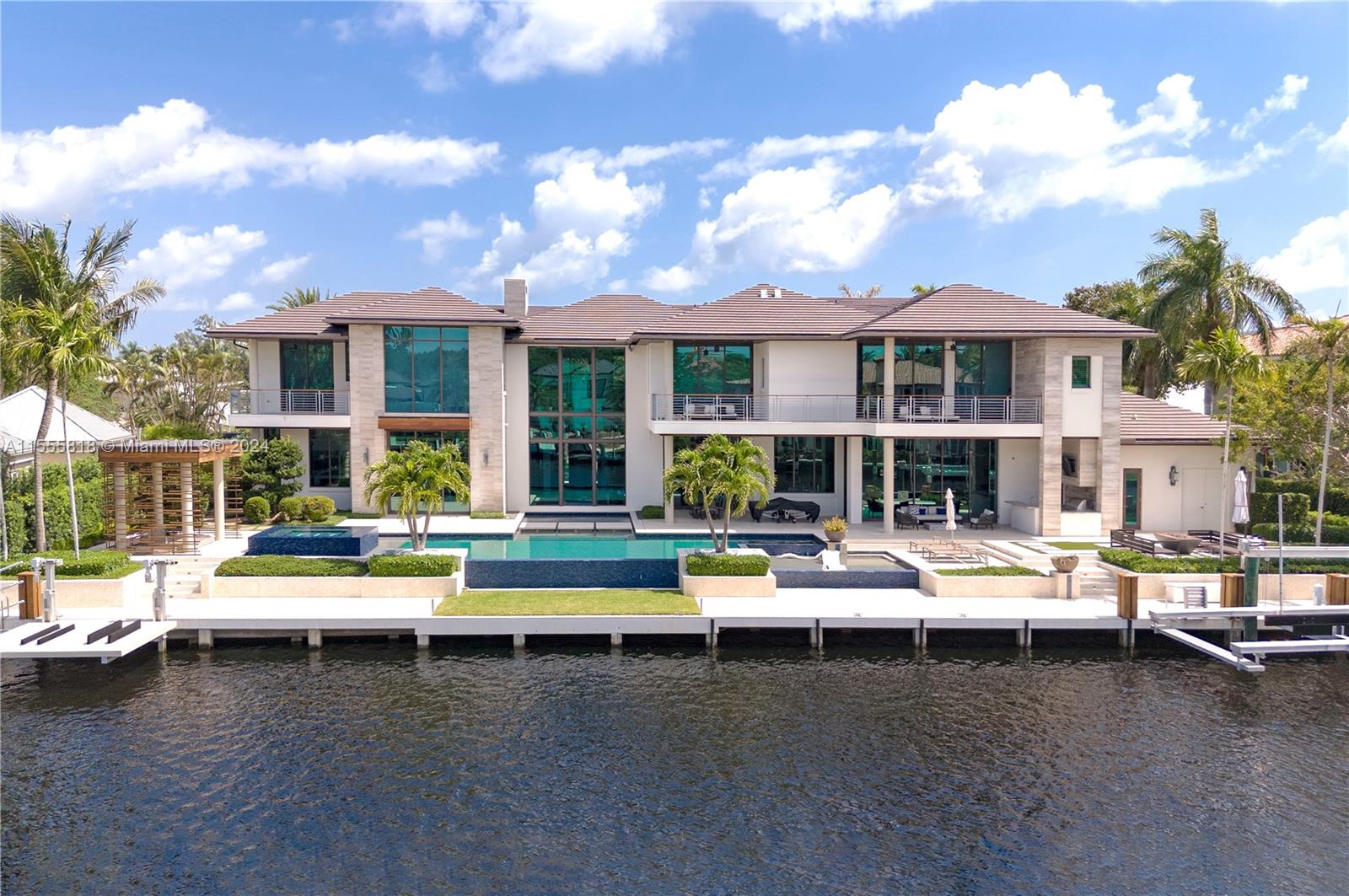 Discover this exclusive luxury waterfront estate in Bay Colony, Ft Lauderdale, designed by renowned Stofft Architects. Nestled within a gated, yachting,& 24/7 armed security community, it offers privacy and peace of mind, mins. from PineCrest School, one of the nation's premier private schools. Enjoy 160' of water frontage seamlessly integrated with 21,135 sft land. Inside, find well-appointed spaces with upscale finishes and Gaggenau appliances, a grand foyer, volume ceilings, ensuite baths in all beds, covered balconies, private gym, theater, clubroom, wine cellar, oversized owner's suite, spa-like bath,chef's kitchen w a breakfast area. Outside, indulge in an infinity pool, gazebo, summer kitchen, fire pit, stone-finished dock, & many more features and details waiting to be discovered!