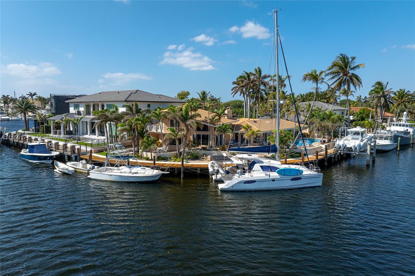 This inimitable east-facing waterfront property located in the picturesque community of Lighthouse Point offers unparalleled water frontage and access to Hillsboro Inlet and Marina. Delivering a private paradise for boaters and a haven for beach-goers, there are endless opportunities to explore the idyllic marine landscape in this vibrant South Florida community. This home offers 180+/- ft. of water-frontage, sits on a spacious and intimately scenic premier lot and is an entertainer’s dream. Nestled directly along the water on Lake Placid, the house is equipped with hurricane glass and a newly built roof. This prime intracoastal community boasts dozens of winding canals and water vistas. What’s more, the property itself showcases endless views of the serene water throughout the house.